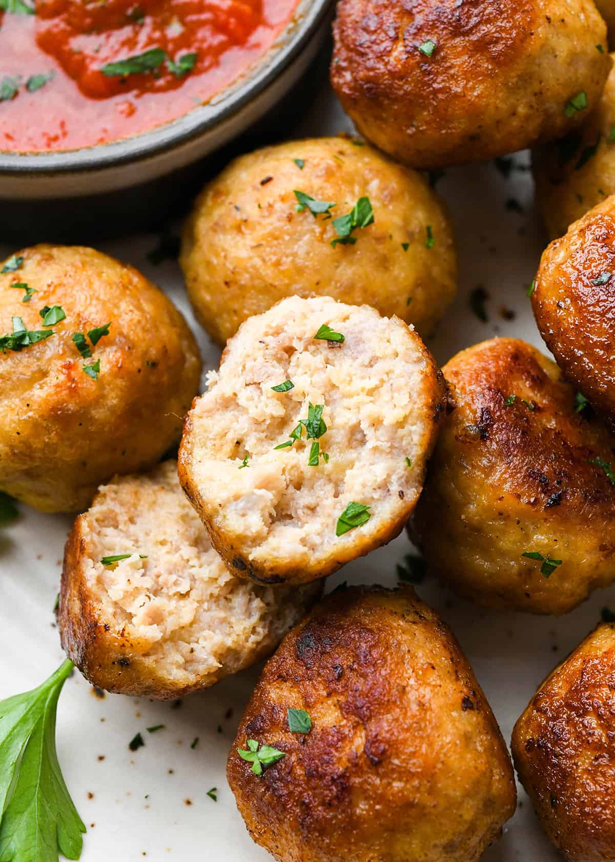 chicken meatballs cut in half so you can see the texture inside 