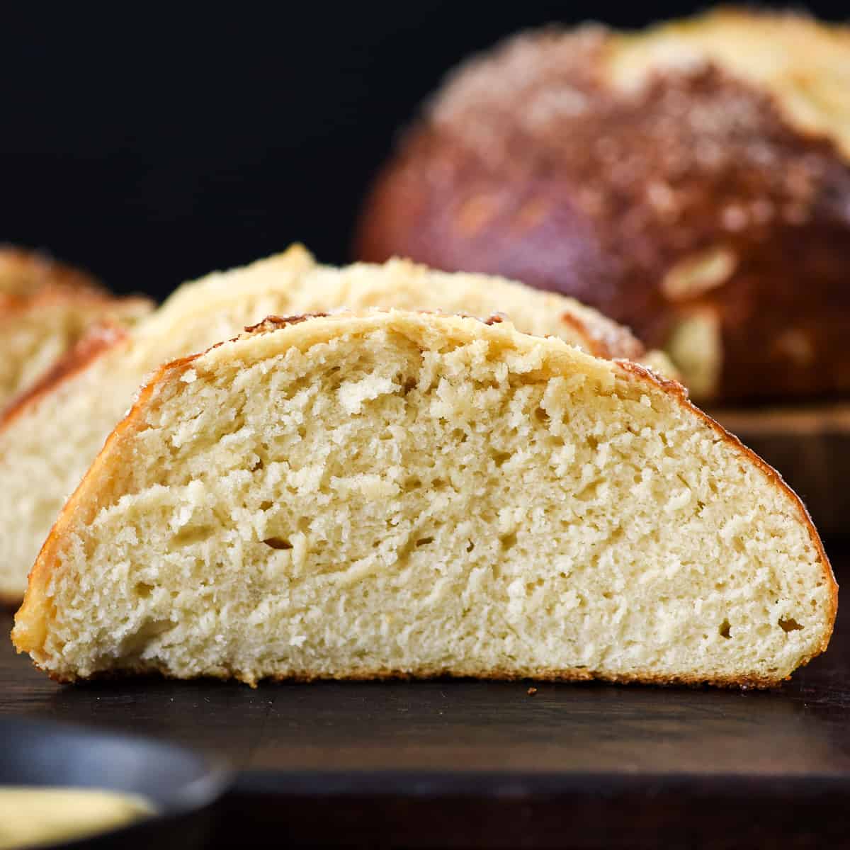 Up close front view of a slice of homemade pretzel bread 