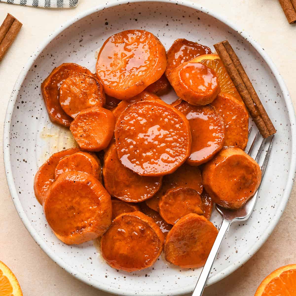 Candied Yams on a plate with a fork