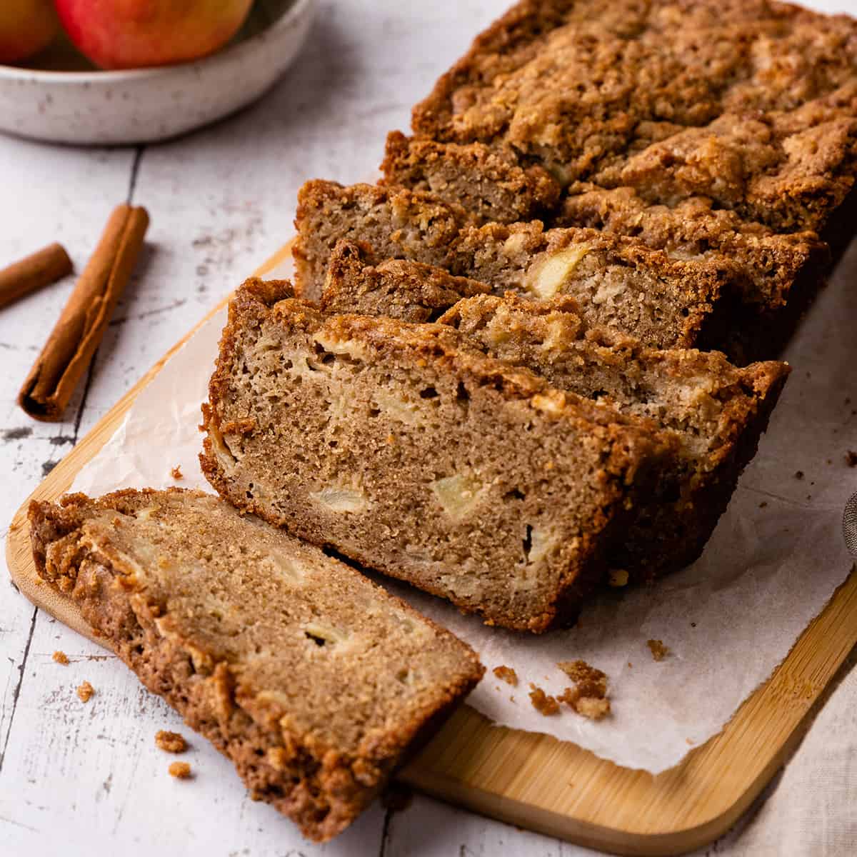 a loaf of Cinnamon Apple Bread with 5 slices cut out of it