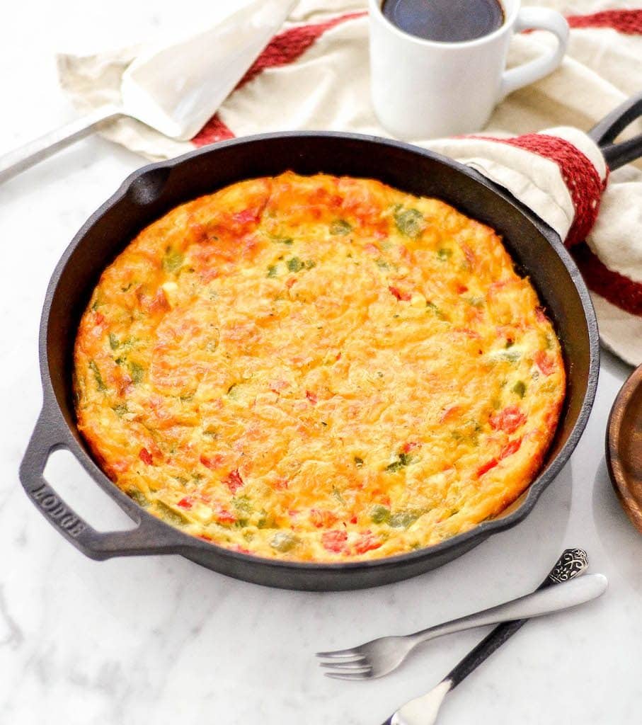 side view of Gluten-Free Crustless Quiche recipe in a cast iron skillet