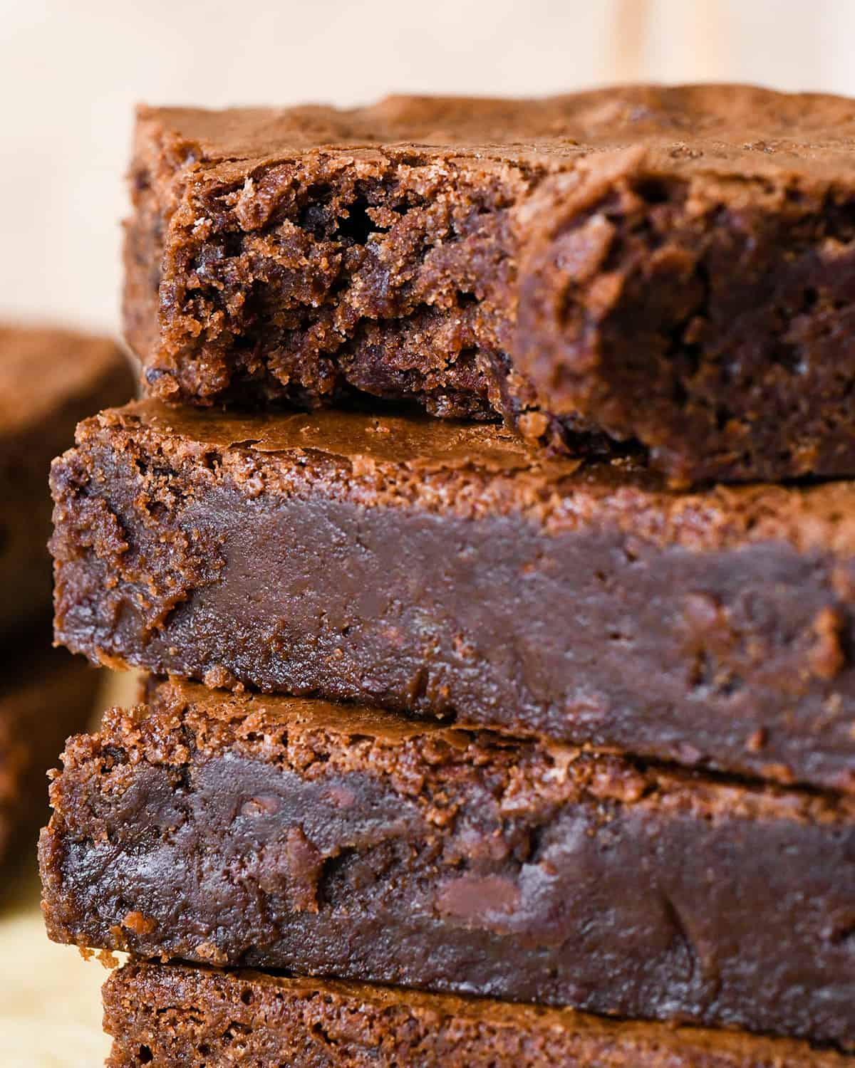 a stack of 4 brownies made with Homemade Brownie Mix, the top has a bite taken out of it