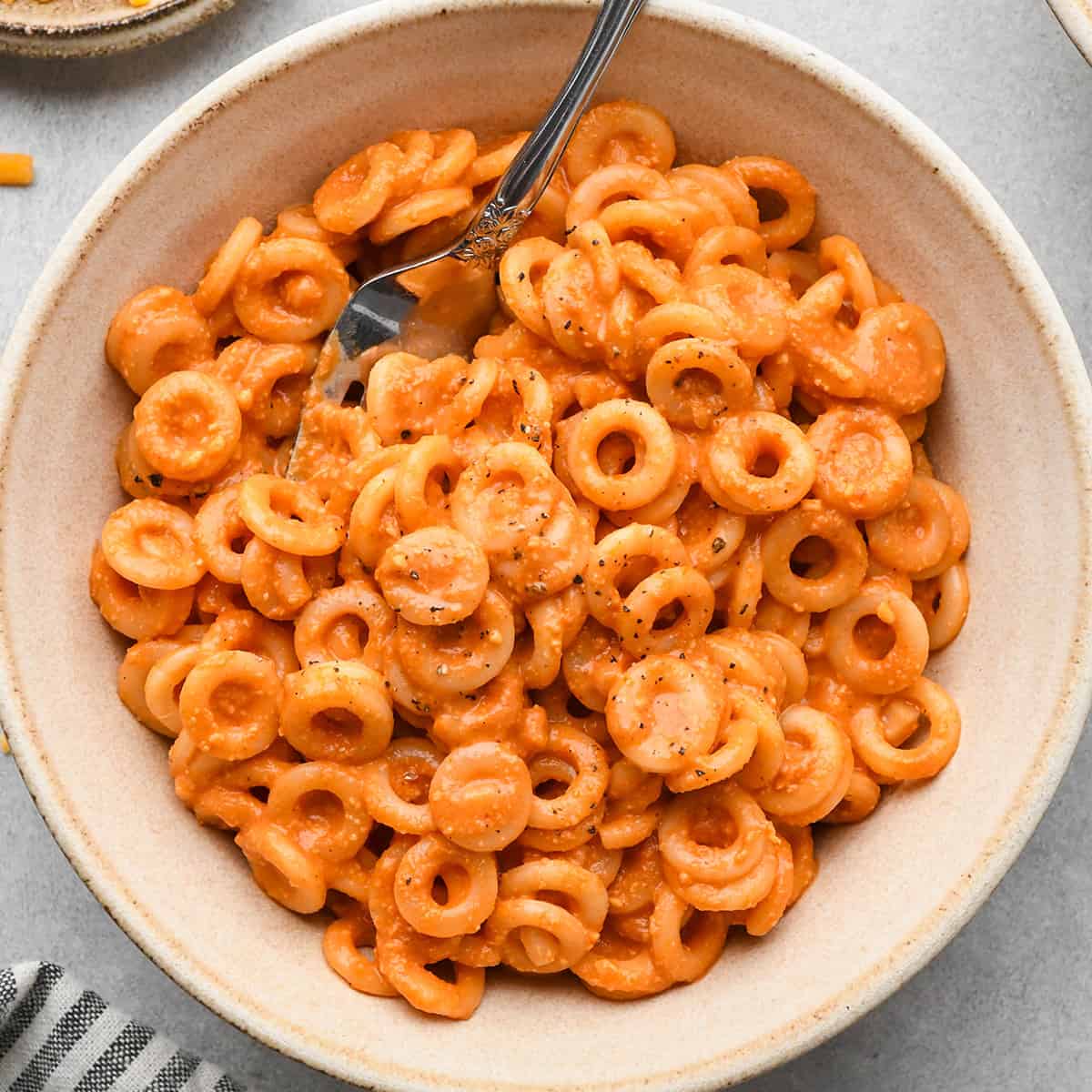 a bowl of Homemade Spaghetti Os with a fork in it