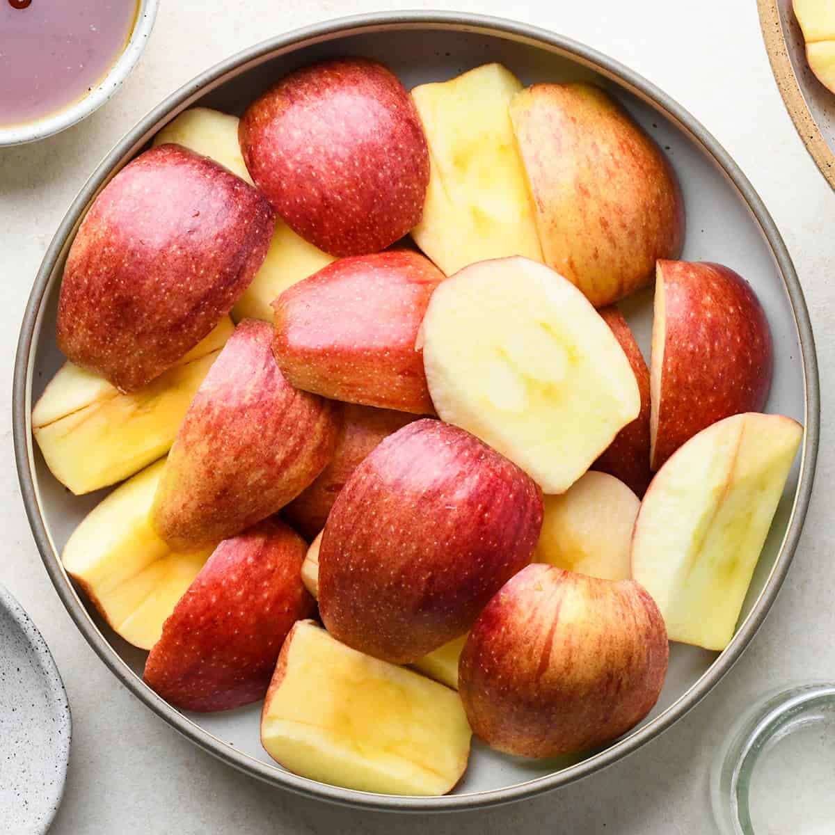 apples cored and sliced to make apple butter