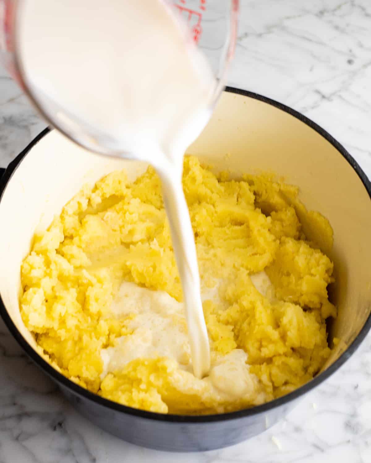 two photos showing how to make mashed potatoes adding milk and potatoes