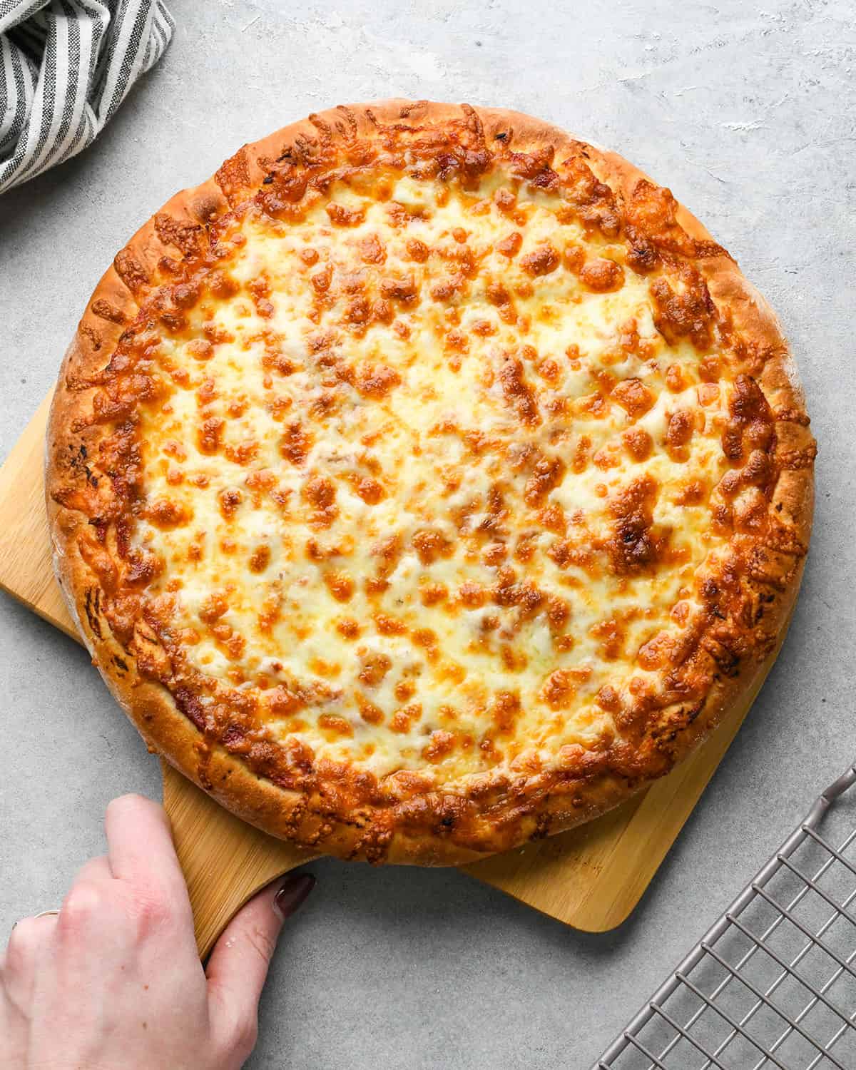 Homemade Pizza Recipe on a pizza peel after baking