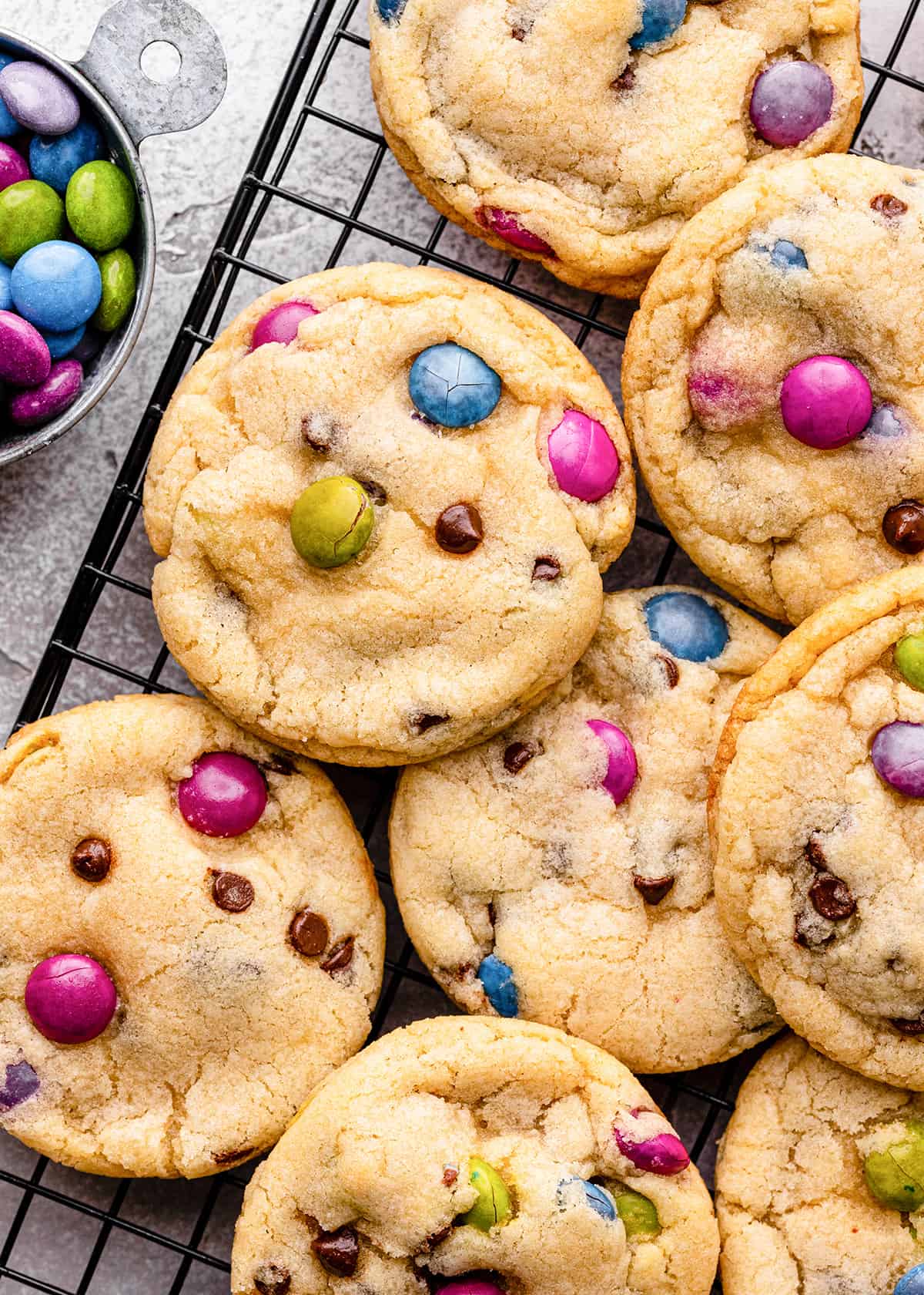 8 M & M Cookies on a wire cooling rack