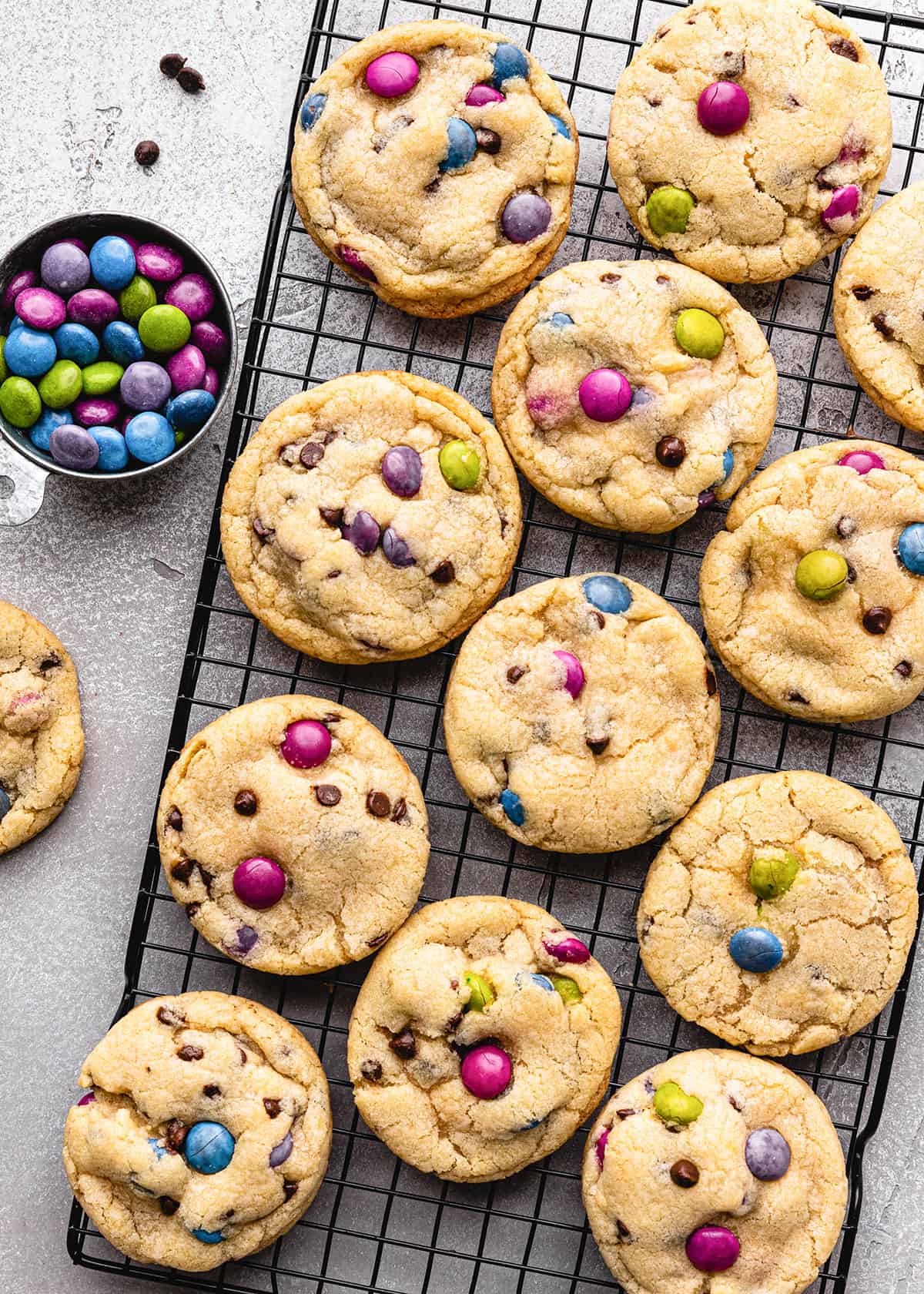 12 M & M cookies on a wire cooling rack