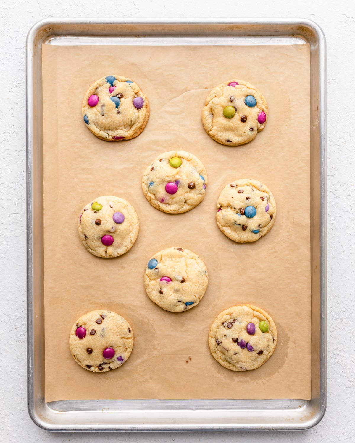 M & M cookies on a baking sheet after baking