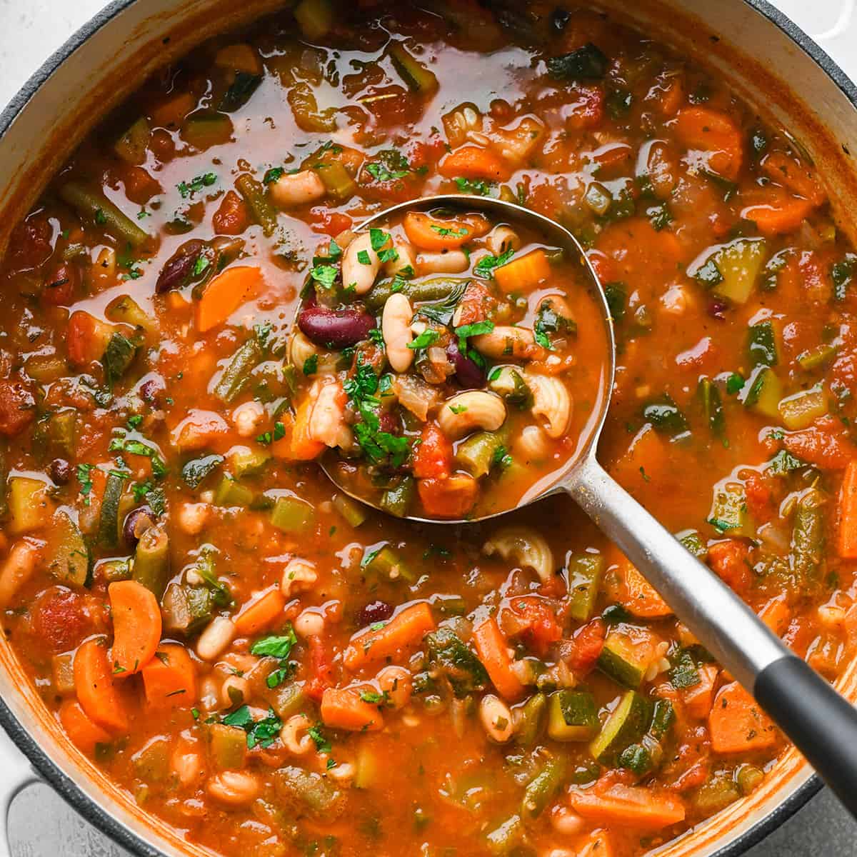 Minestrone Soup in a pot with a ladle